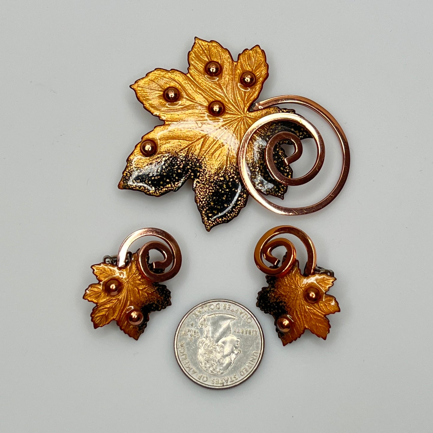 Matisse copper enamel maple leaf brooch and clip-on earring set in gold and black, signed mid-century vintage