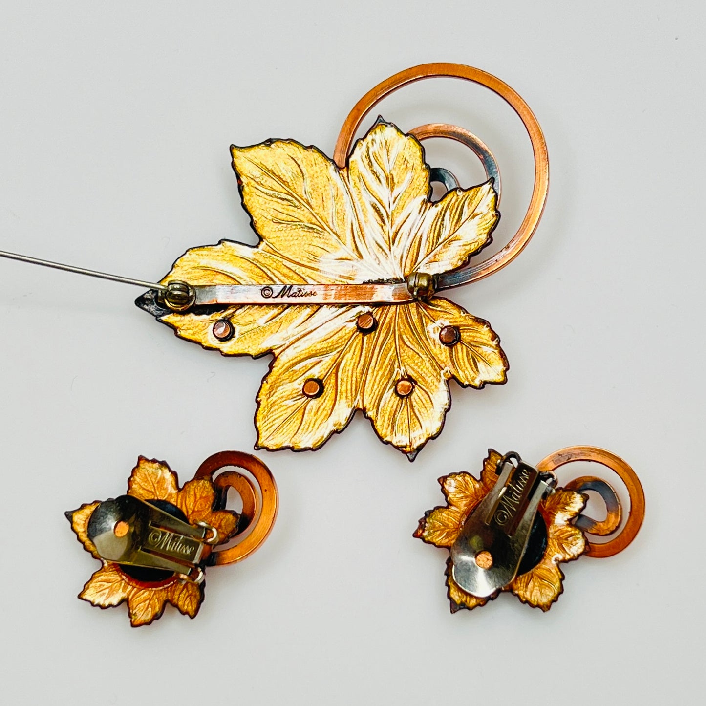 Matisse copper enamel maple leaf brooch and clip-on earring set in gold and black, signed mid-century vintage