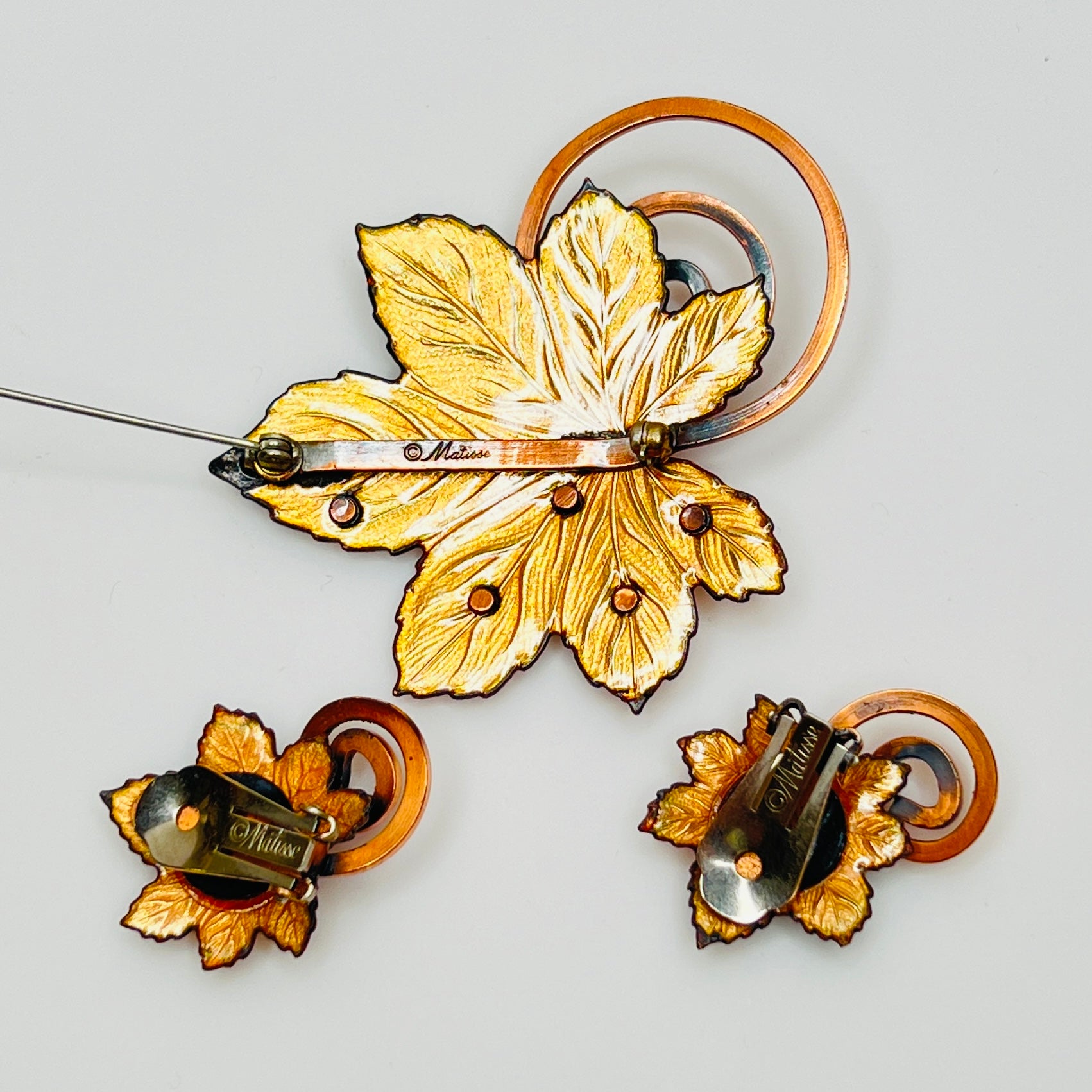 Matisse copper enamel maple leaf brooch and clip-on earring set in gold and black, signed mid-century vintage