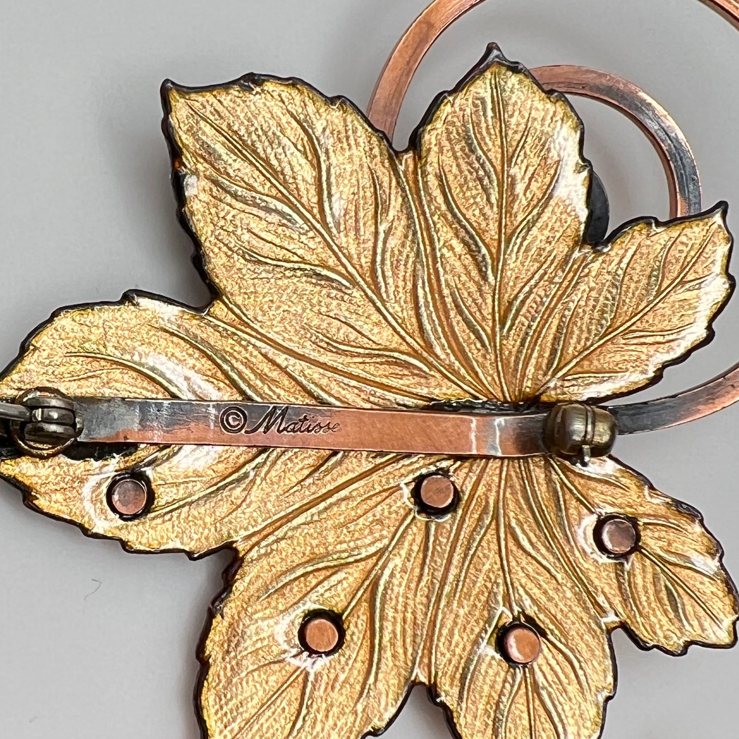 Matisse copper enamel maple leaf brooch and clip-on earring set in gold and black, signed mid-century vintage