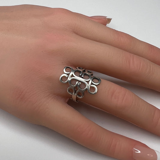 Vintage sterling silver Mexican swirl ring with openwork Aztec design