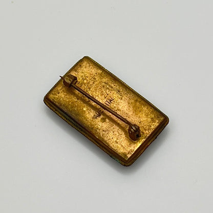 Back of micro mosaic brooch showing "Made in Italy" mark and C-clasp closure