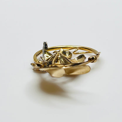 Signed A Regal floral brooch in gold-tone with crystal rhinestone