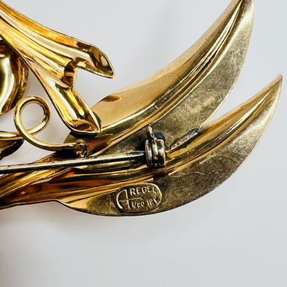 Signed A Regal floral brooch in gold-tone with crystal rhinestone