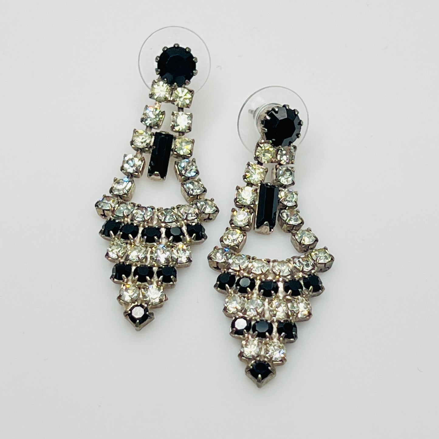 Art Deco-style earrings with black and clear rhinestones in a long silver-tone design