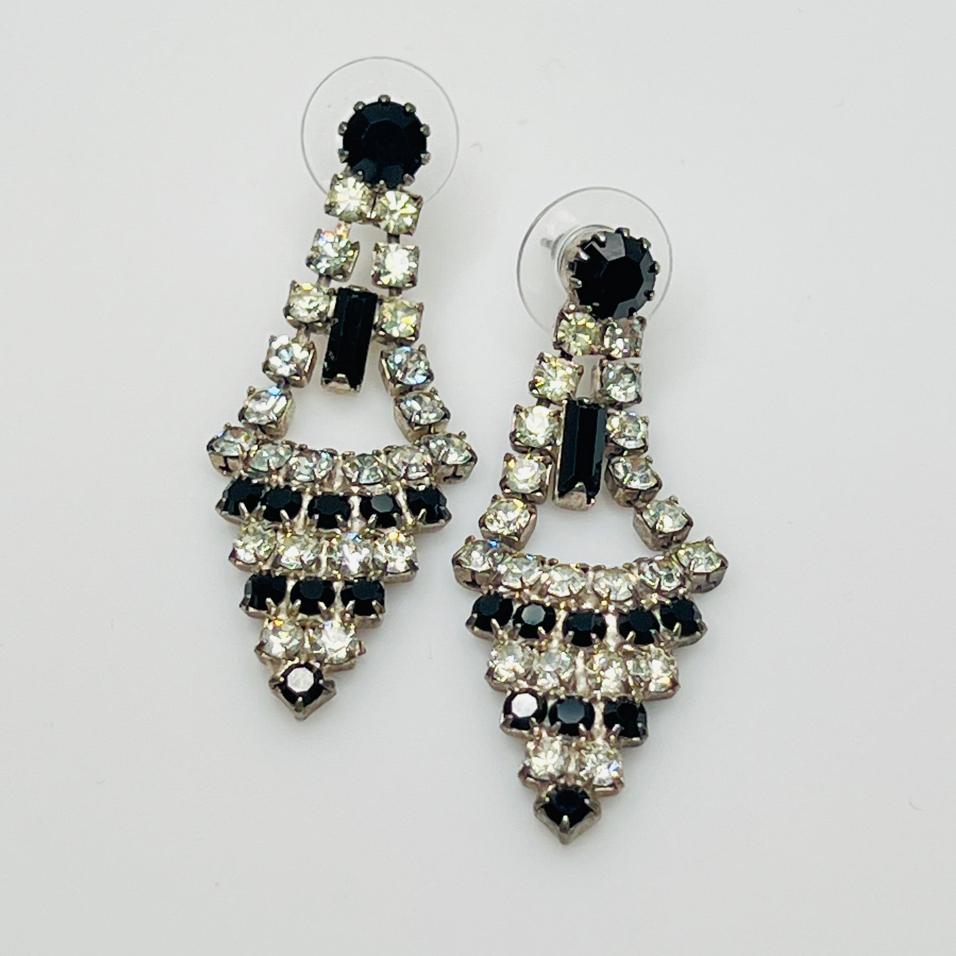 Art Deco-style earrings with black and clear rhinestones in a long silver-tone design