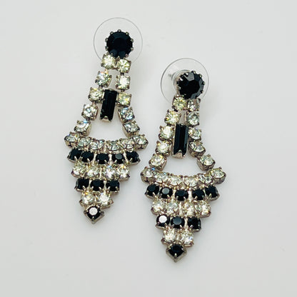 Art Deco-style earrings with black and clear rhinestones in a long silver-tone design