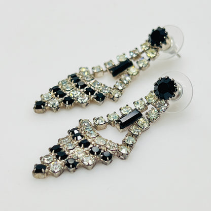 Art Deco-style earrings with black and clear rhinestones in a long silver-tone design