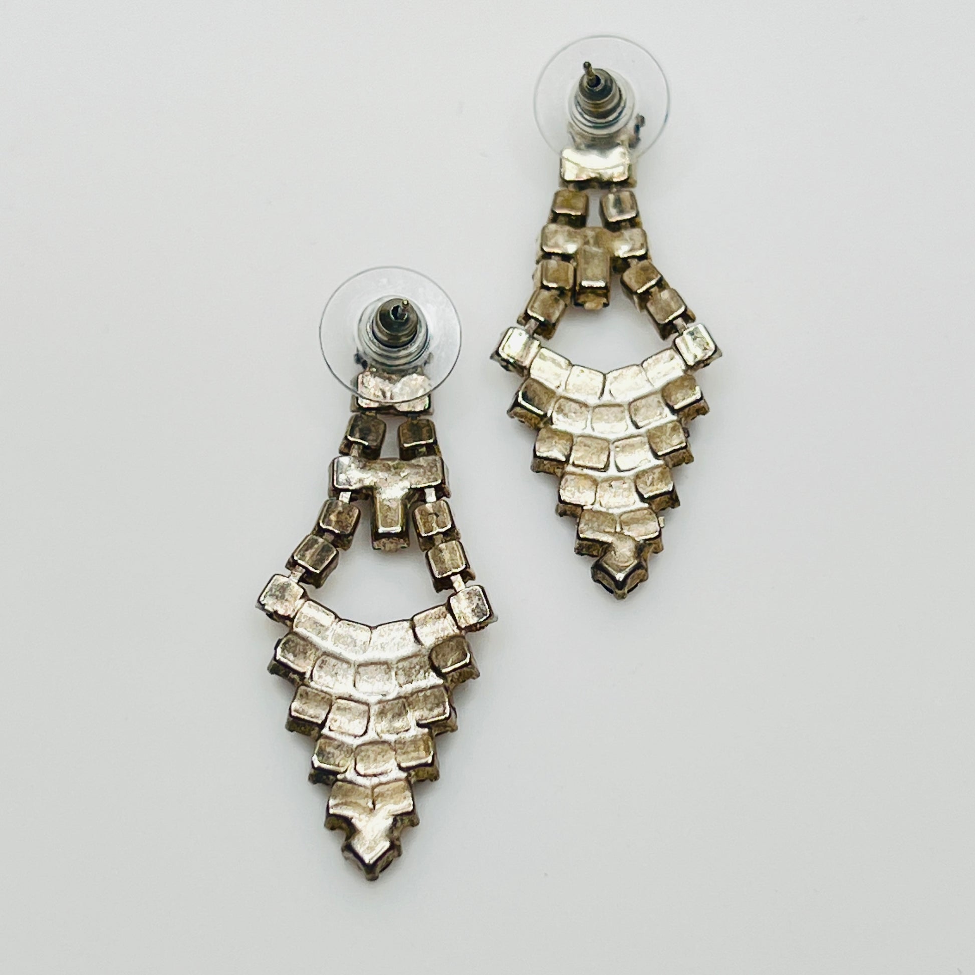 Art Deco-style earrings with black and clear rhinestones in a long silver-tone design