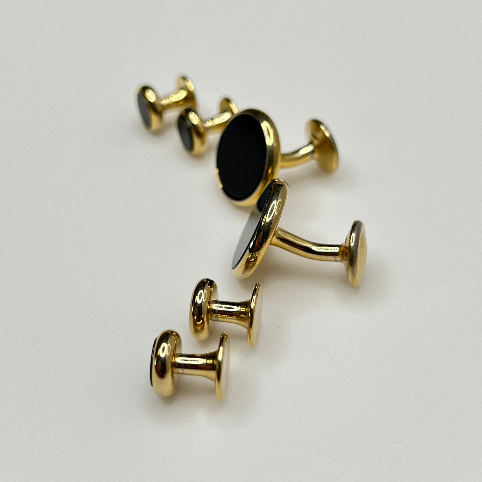 Gold-tone vintage tuxedo set with black glass cufflinks and shirt studs, formalwear set