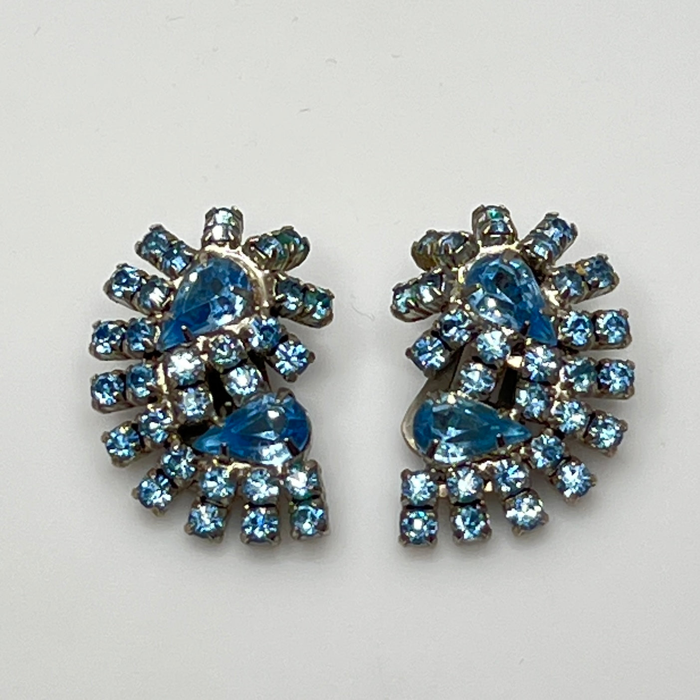 Vintage pale blue rhinestone clip-on earrings with fanburst design