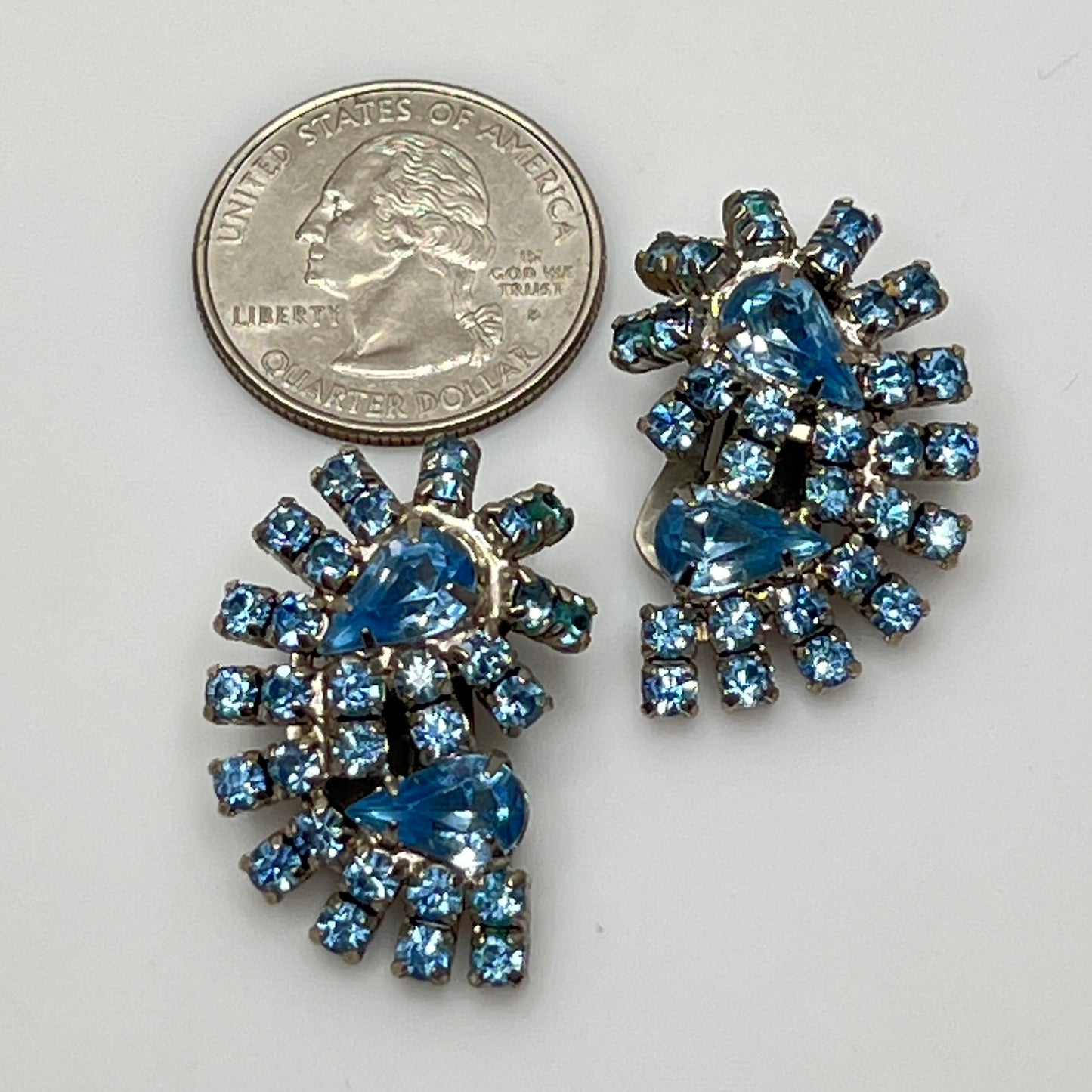 Vintage pale blue rhinestone clip-on earrings with fanburst design