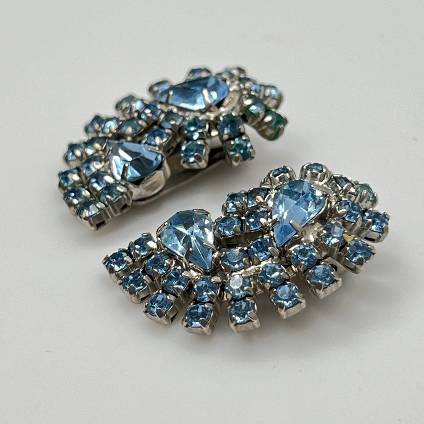 Side view of mid-century blue rhinestone clip-on earrings