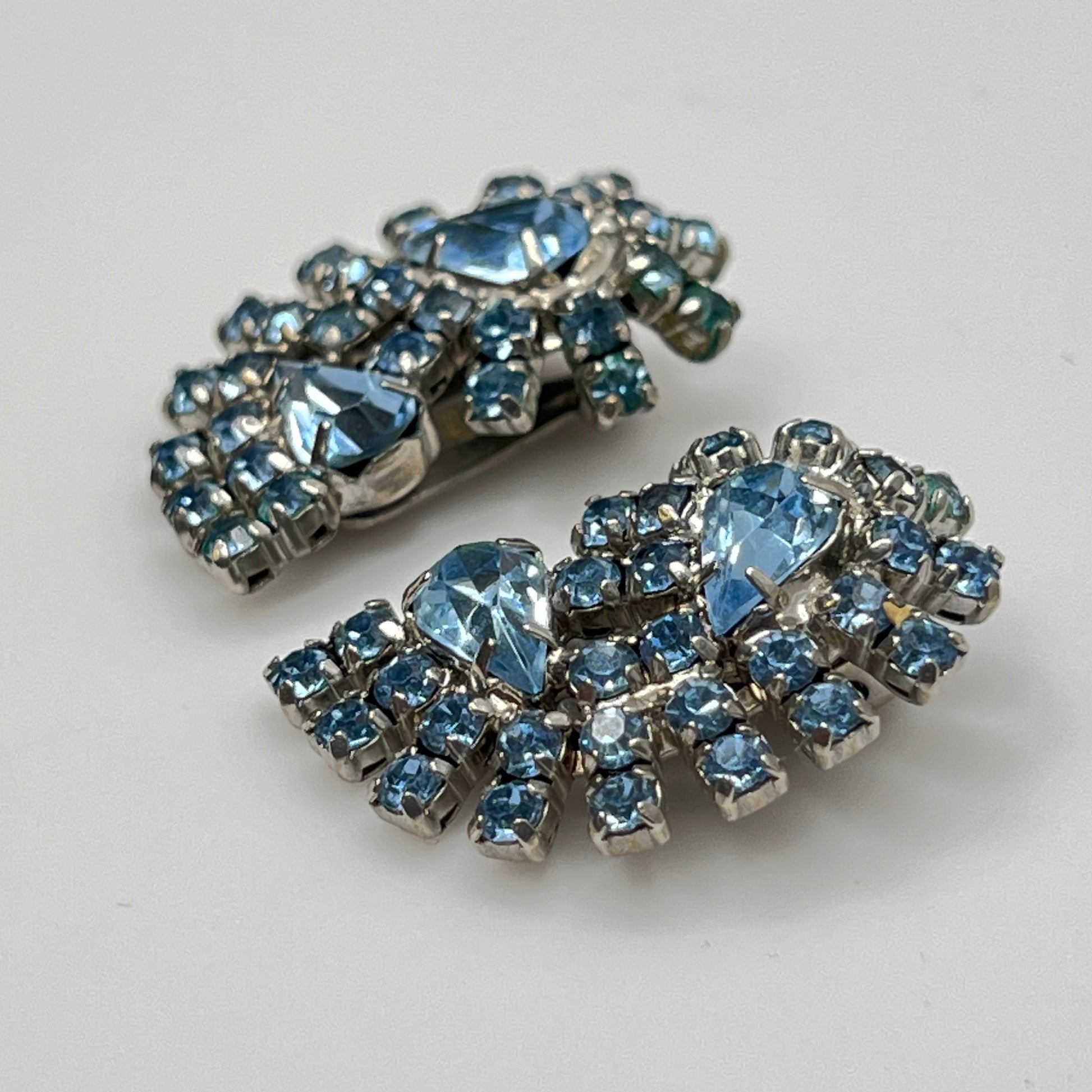 Side view of mid-century blue rhinestone clip-on earrings