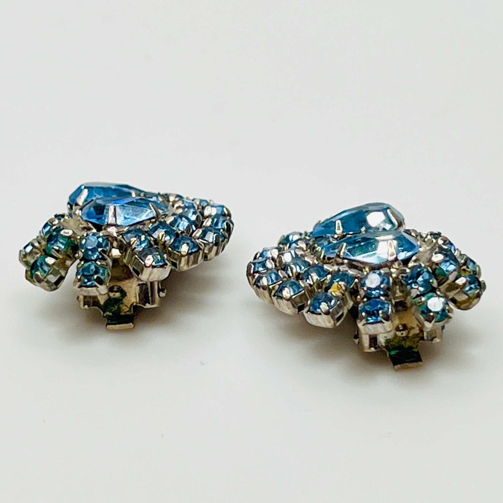 Side view of mid-century blue rhinestone clip-on earrings