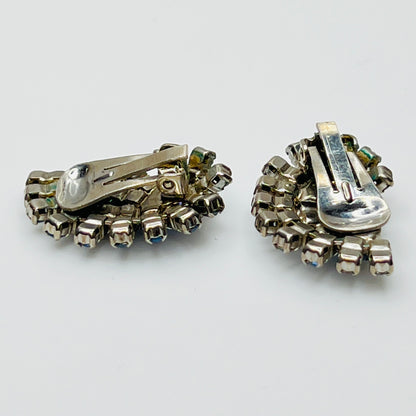 Close-up of teardrop and round rhinestones in silver-tone setting