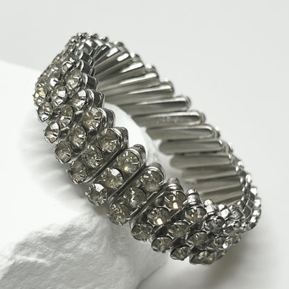 Close-up of vintage silver-tone accordion rhinestone bracelet 