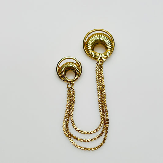 Mid-century gold chatelaine brooch with double wreaths, bow detail, and triple chain drape