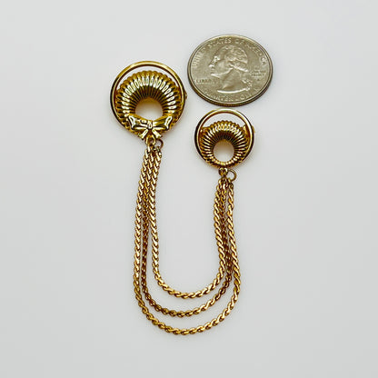 Mid-century gold chatelaine brooch with double wreaths, bow detail, and triple chain drape