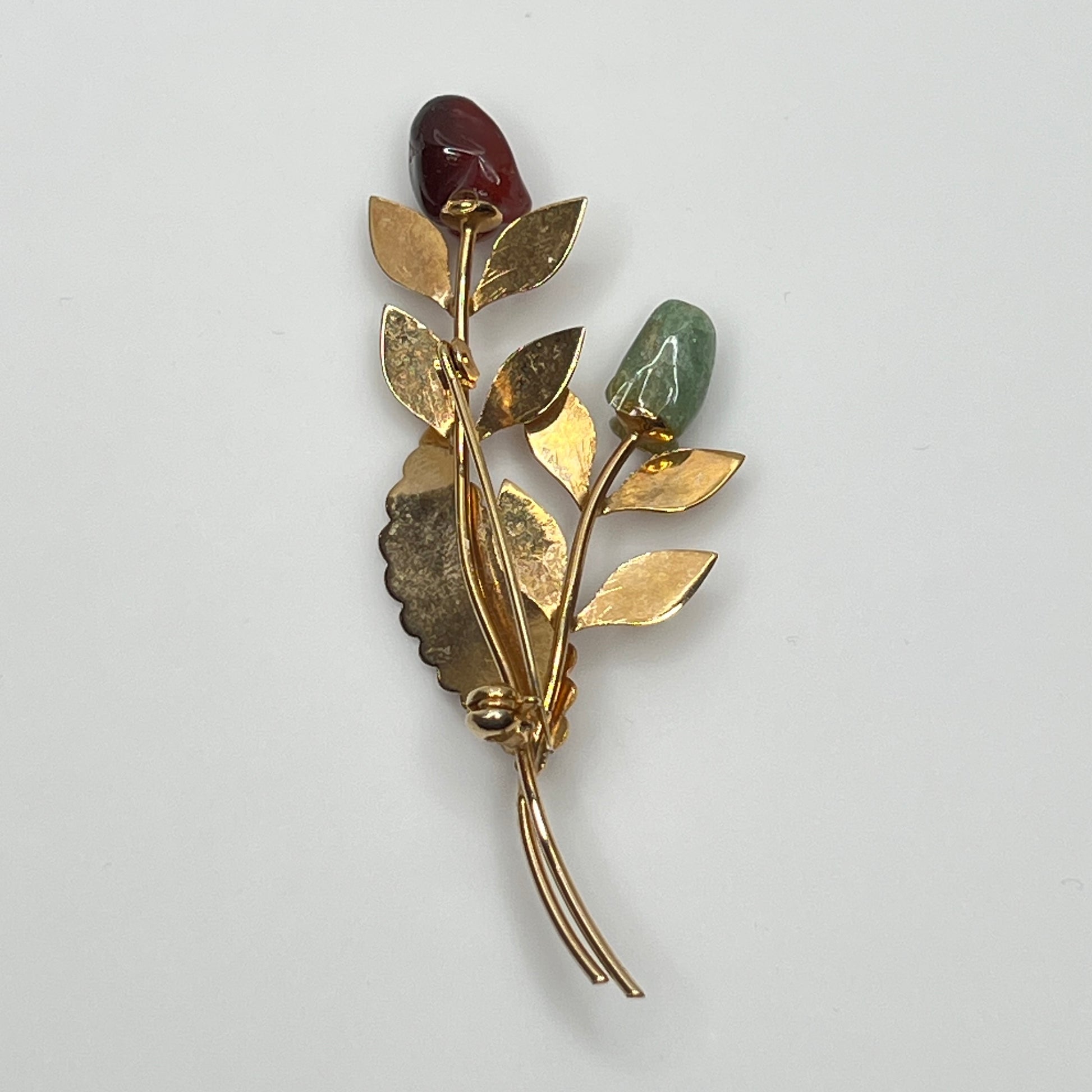 Vintage gold-tone brooch with red and green jade rose buds on long stem