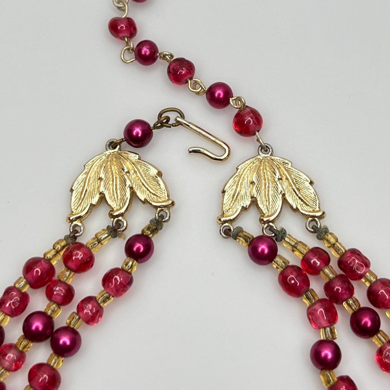 Gold-tone leaf hook clasp stamped Japan on vintage beaded necklace