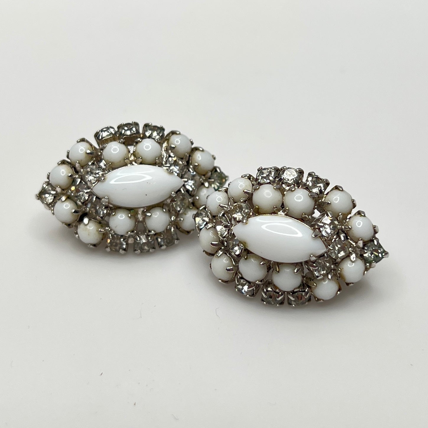 Mid-century milk glass and rhinestone clip-on earrings in marquise shape