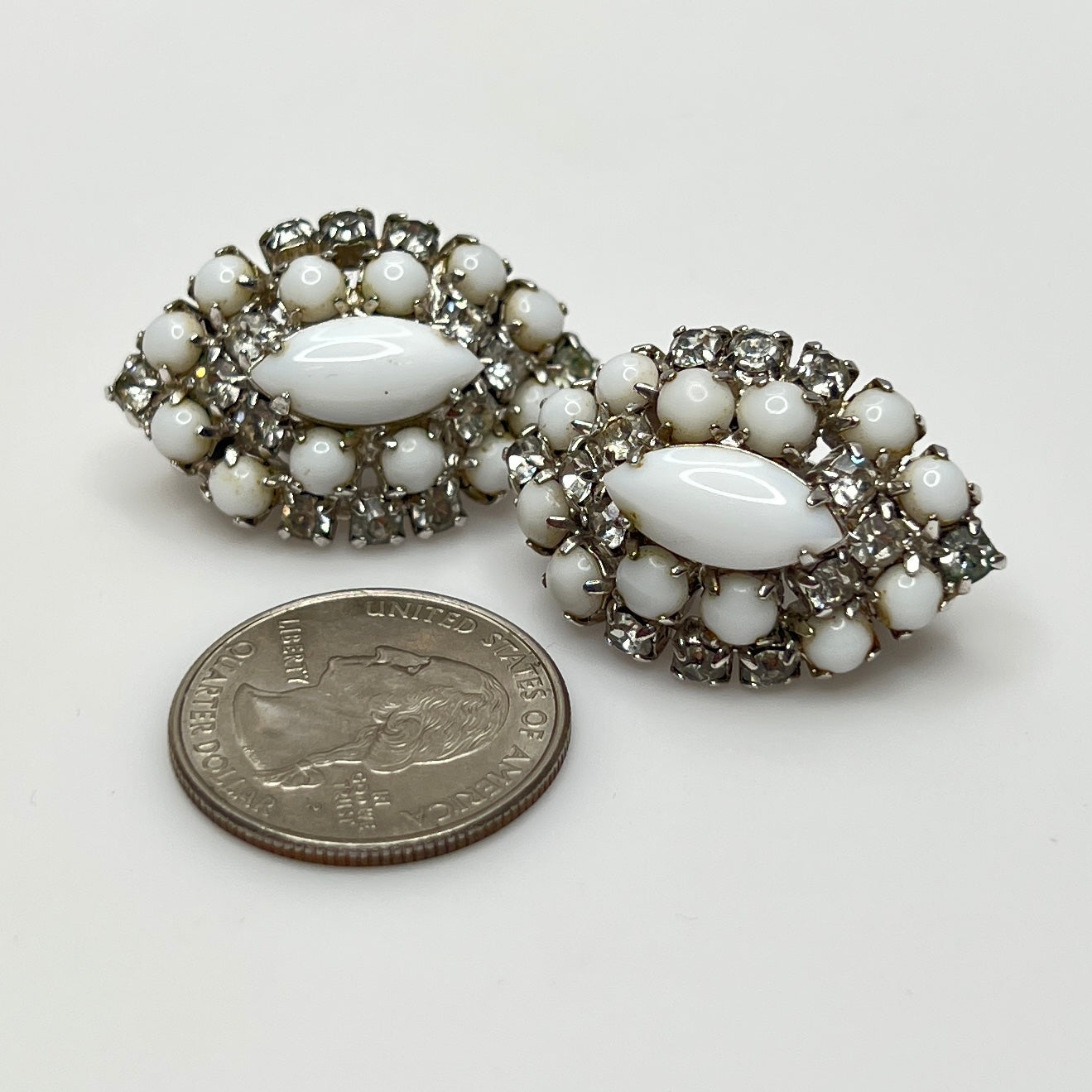Mid-century milk glass and rhinestone clip-on earrings in marquise shape