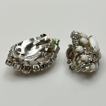 White vintage clip earrings with clear rhinestones and oval centers