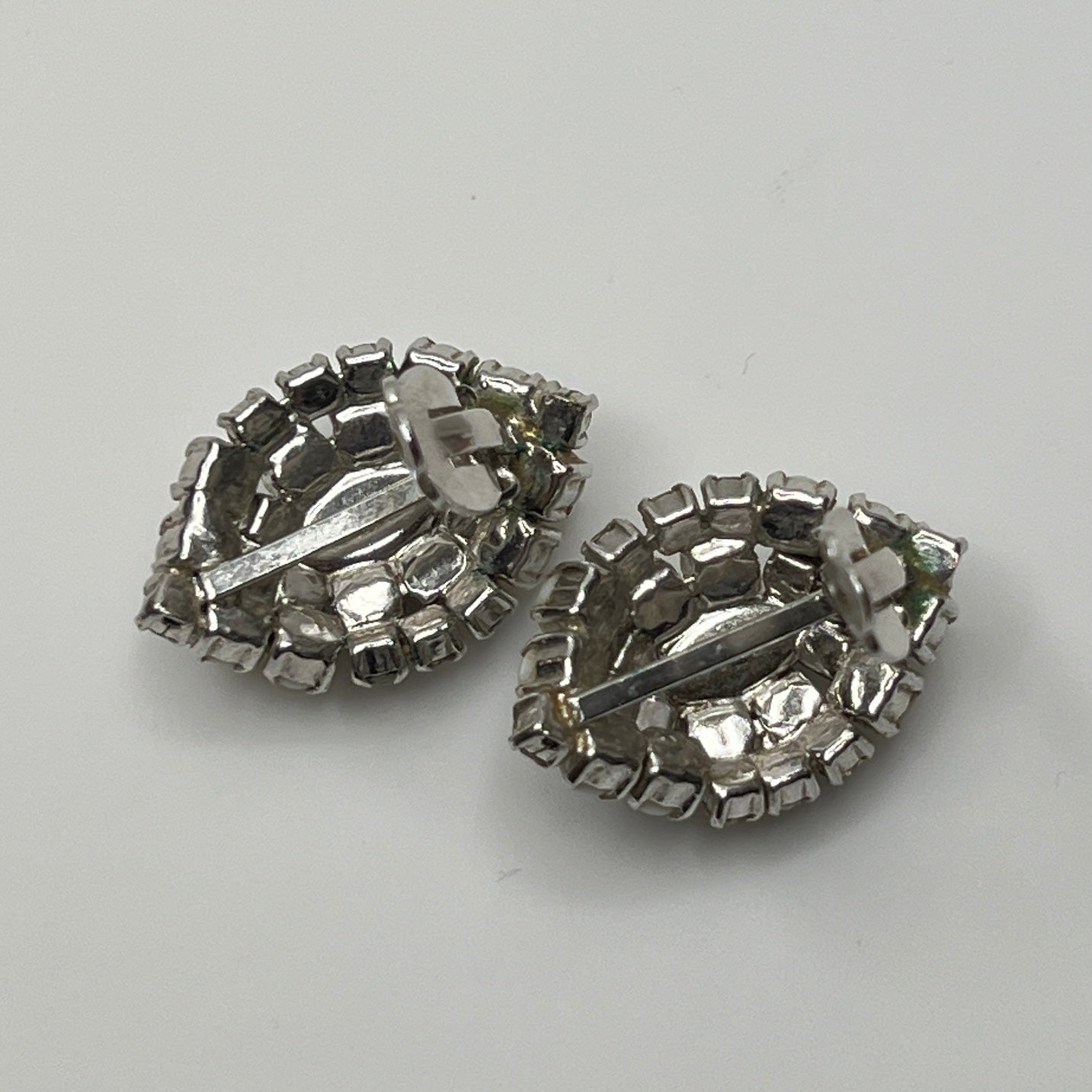 1950s milk glass rhinestone earrings with sculptural silver-tone setting