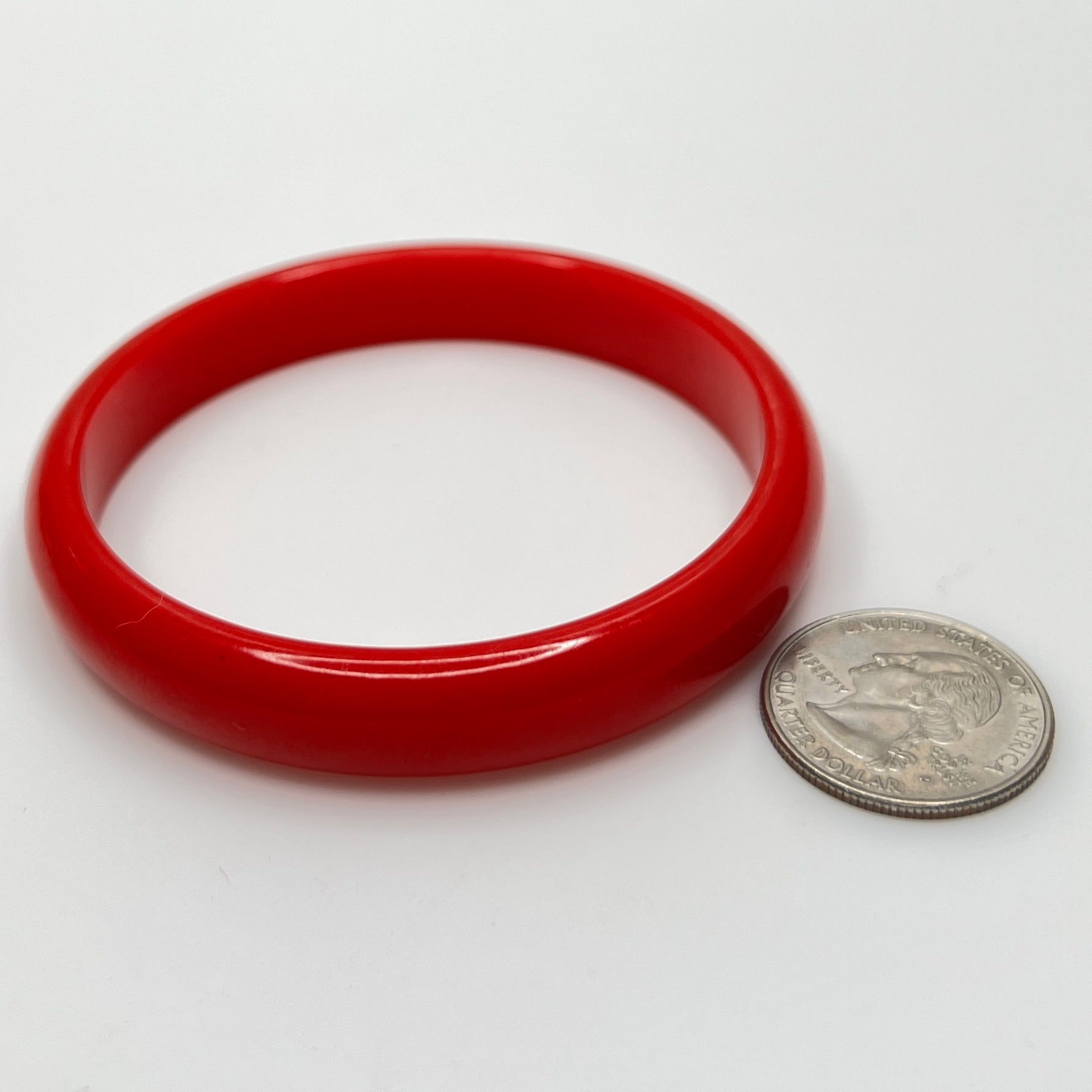 Classic cherry red Bakelite bangle with smooth polished surface