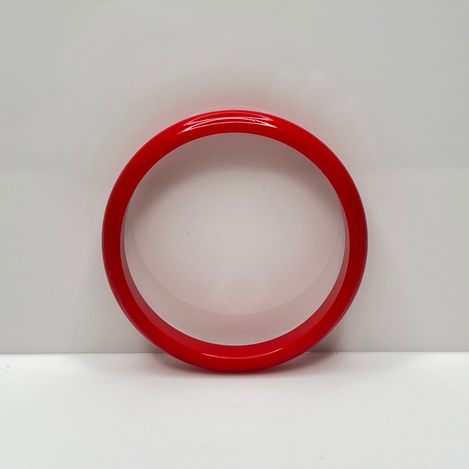 Classic cherry red Bakelite bangle with smooth polished surface