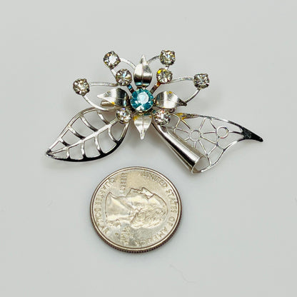 Close-up of brooch with prong-set rhinestones