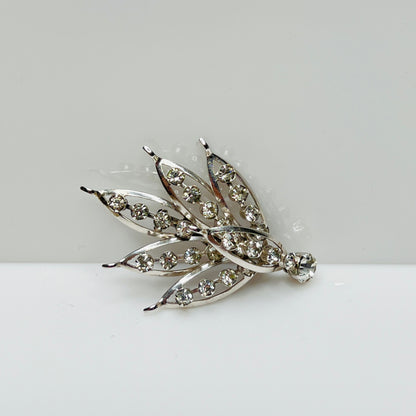 Silver-tone rhinestone leaf brooch with openwork design