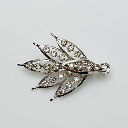 Close-up of vintage rhinestone brooch with prong-set stones