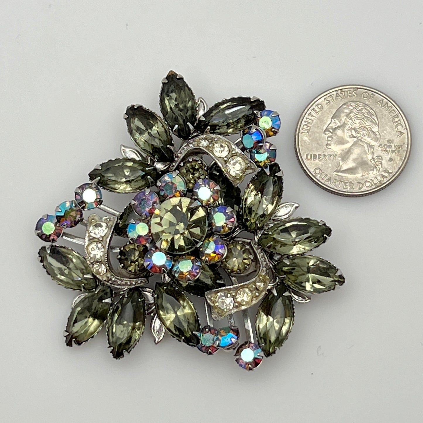 1950s silver-tone rhinestone brooch with leaf and ribbon motif