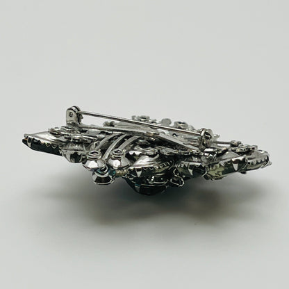 1950s silver-tone rhinestone brooch with leaf and ribbon motif