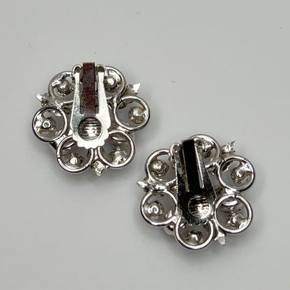 Vintage clip-on earrings with light blue rhinestones and red glass cabochons