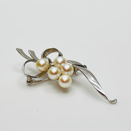Vintage silver floral brooch with ribbon detail and clustered pearls