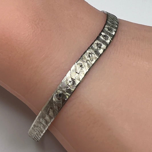 Vintage Milor sterling silver textured snake chain bracelet worn on wrist