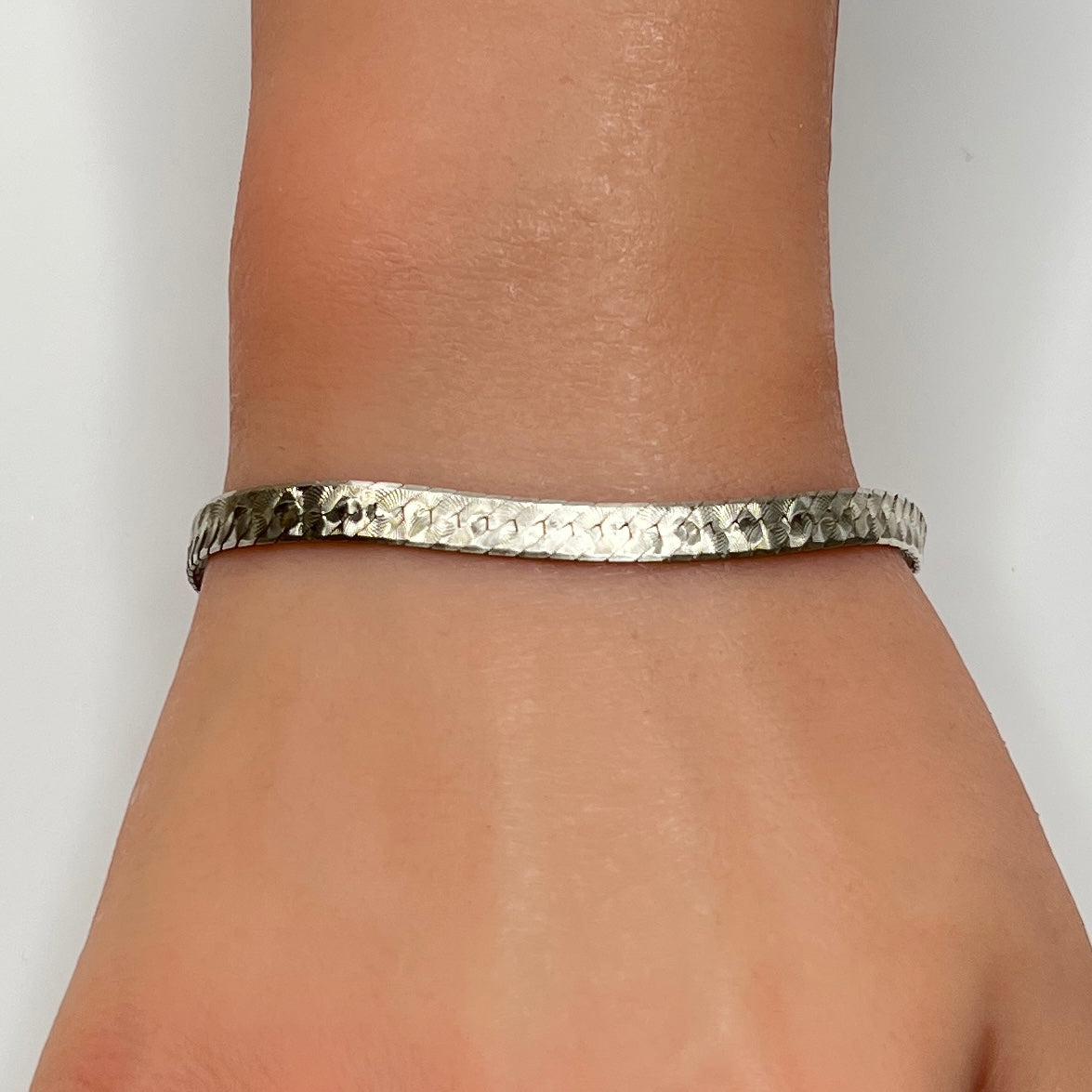 Vintage Milor sterling silver textured snake chain bracelet worn on wrist