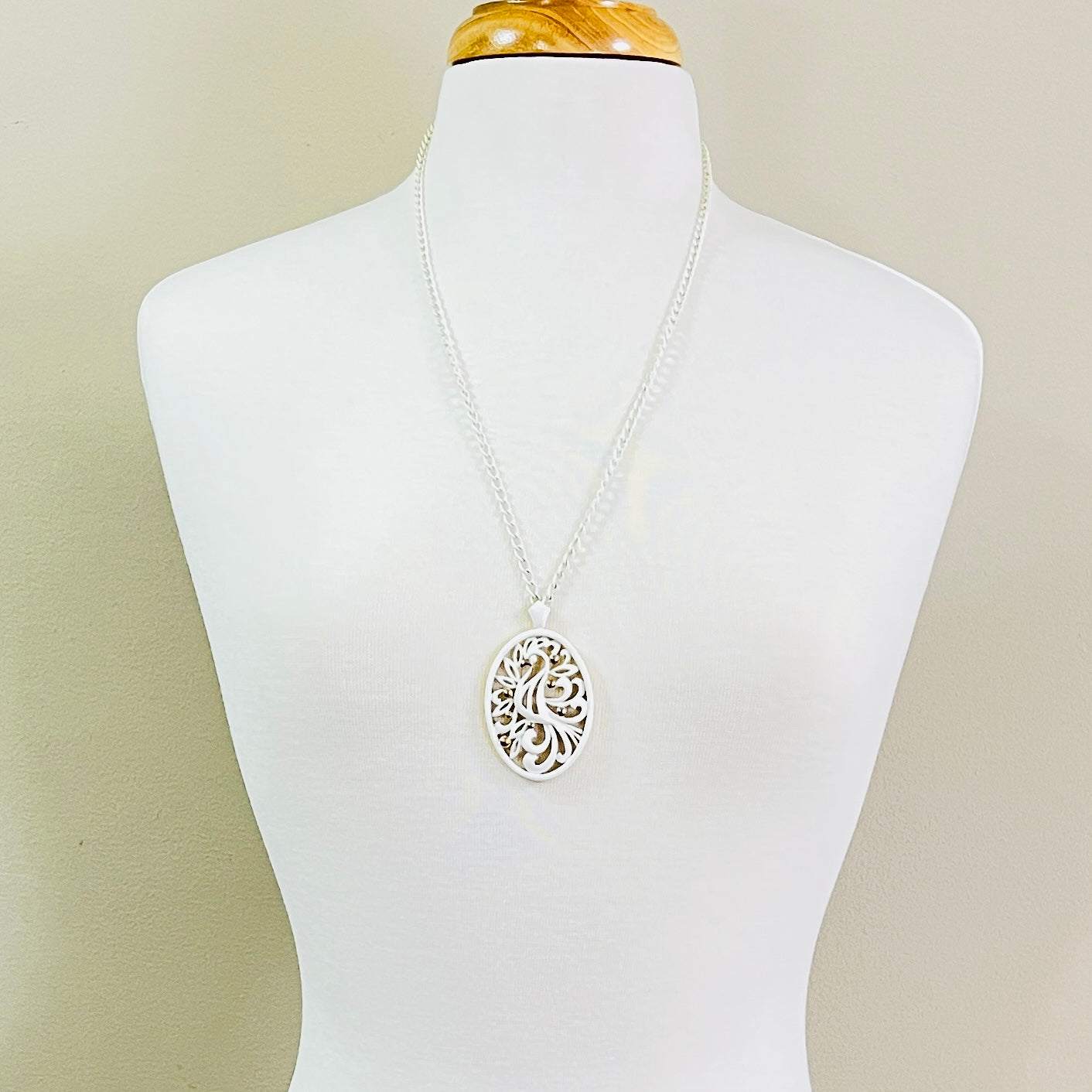 White enamel Monet jewelry set with bird of paradise motif 