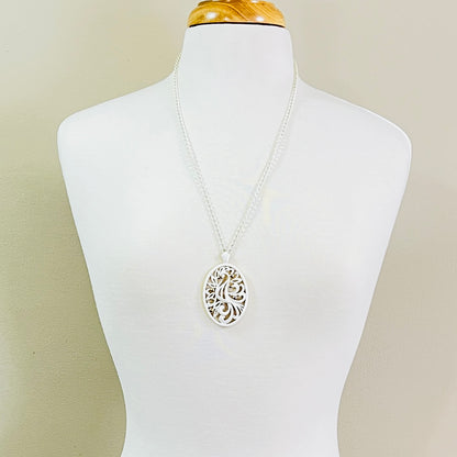 White enamel Monet jewelry set with bird of paradise motif 