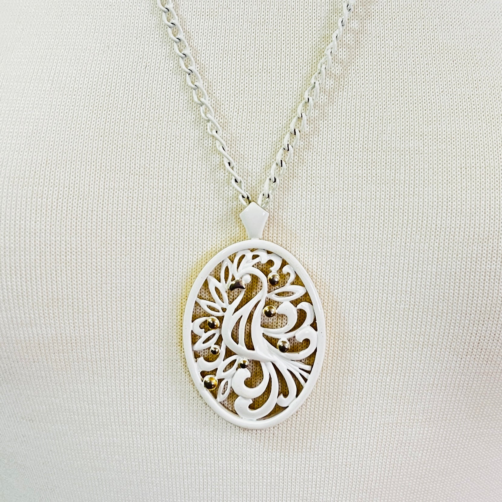 White enamel Monet jewelry set with bird of paradise motif 