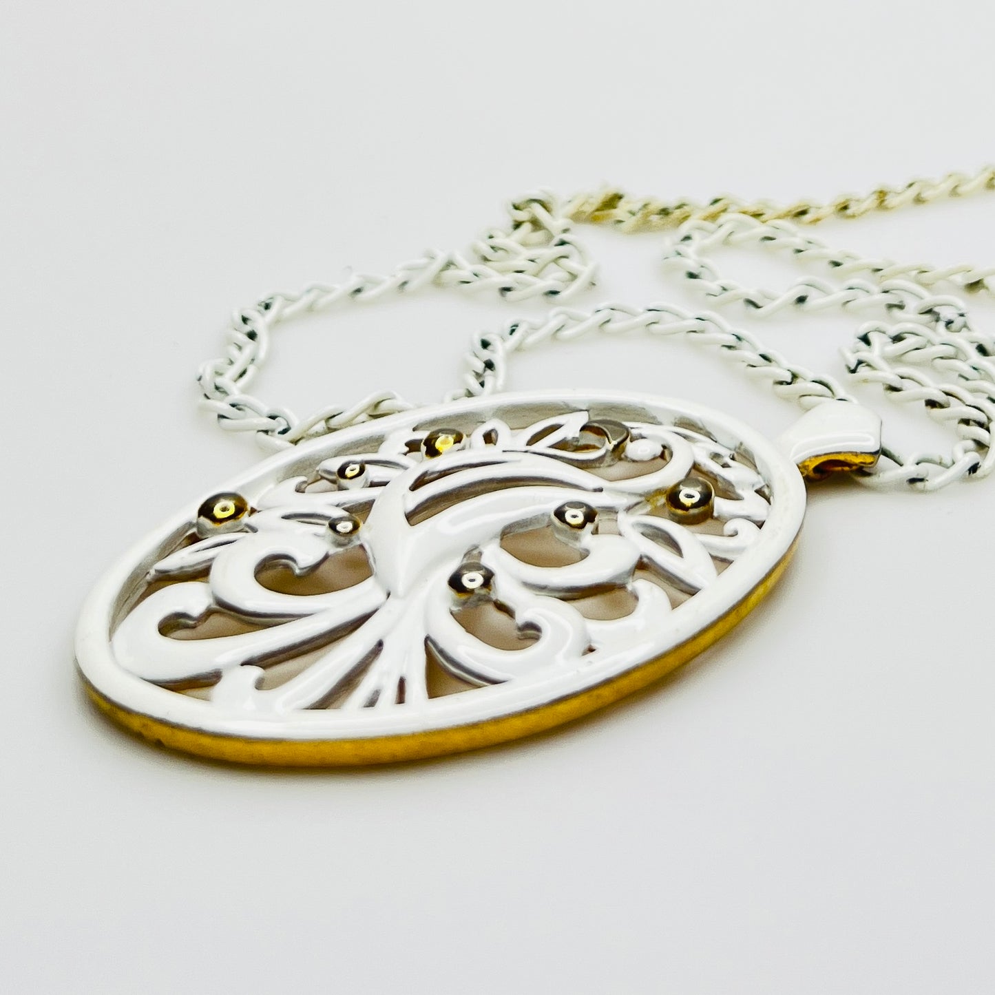 White enamel Monet jewelry set with bird of paradise motif 
