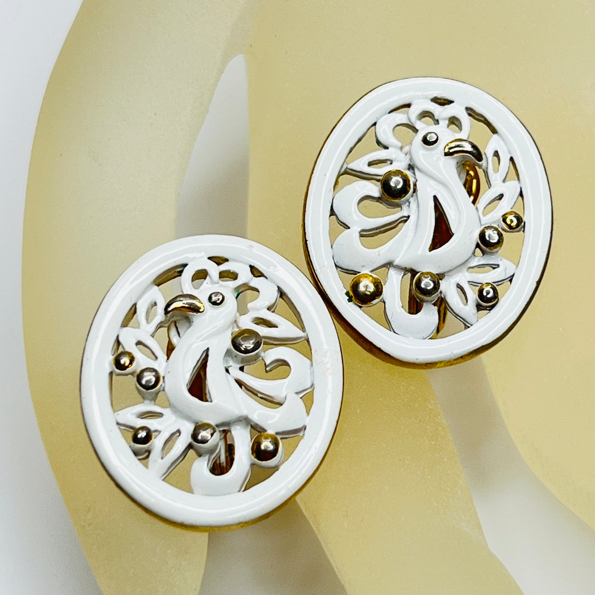 White enamel Monet jewelry set with bird of paradise motif clip-on earrings