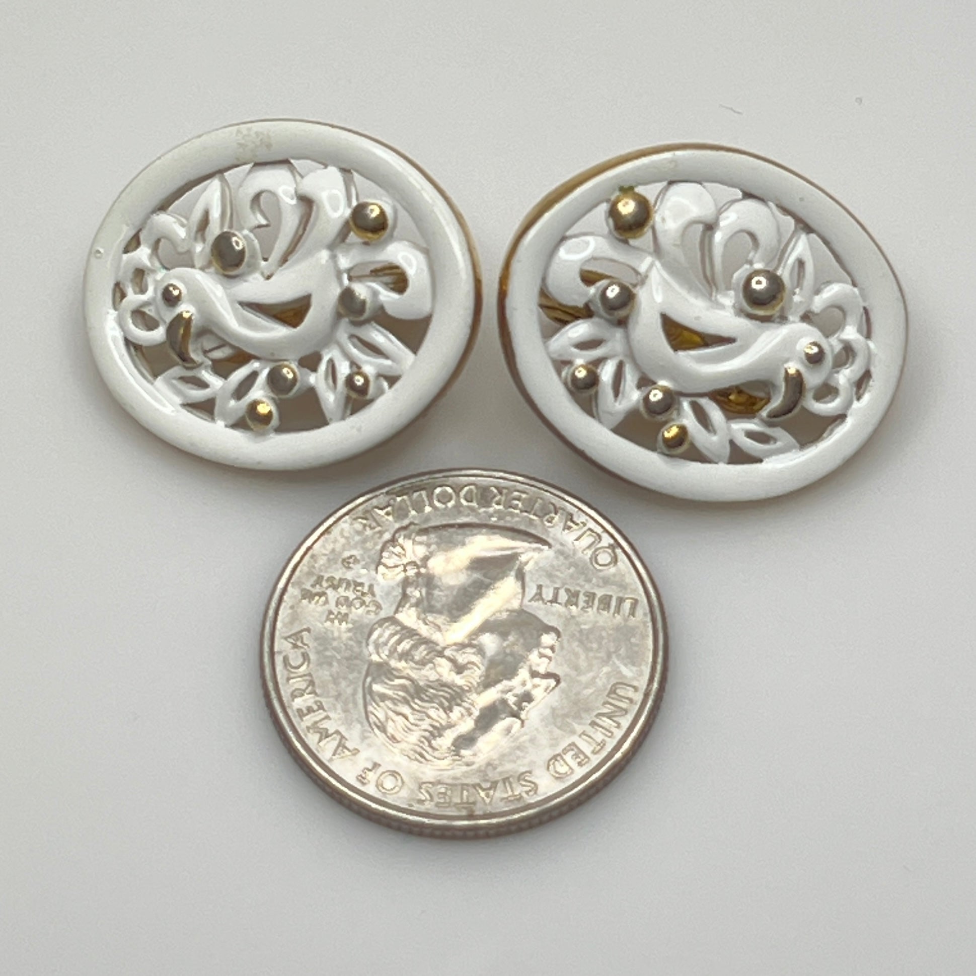 White enamel Monet jewelry set with bird of paradise motif clip-on earrings