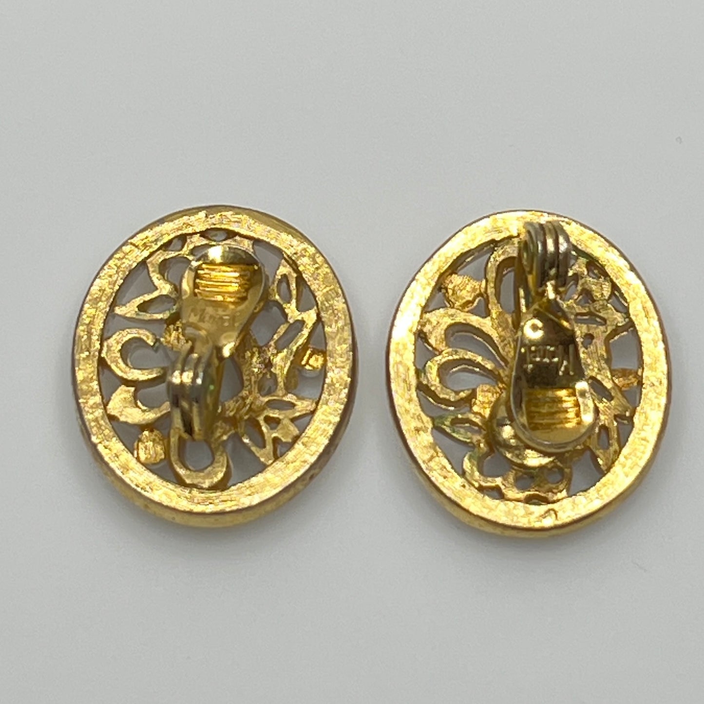 White enamel Monet jewelry set with bird of paradise motif clip-on earrings