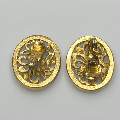 White enamel Monet jewelry set with bird of paradise motif clip-on earrings