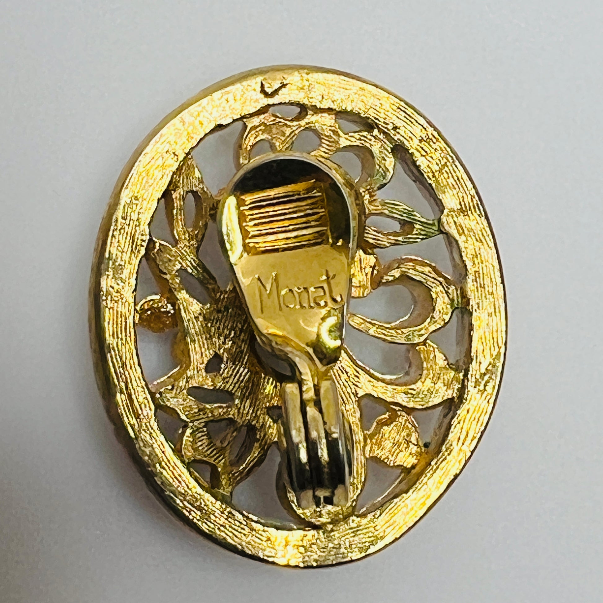 White enamel Monet jewelry set with bird of paradise motif clip-on earrings