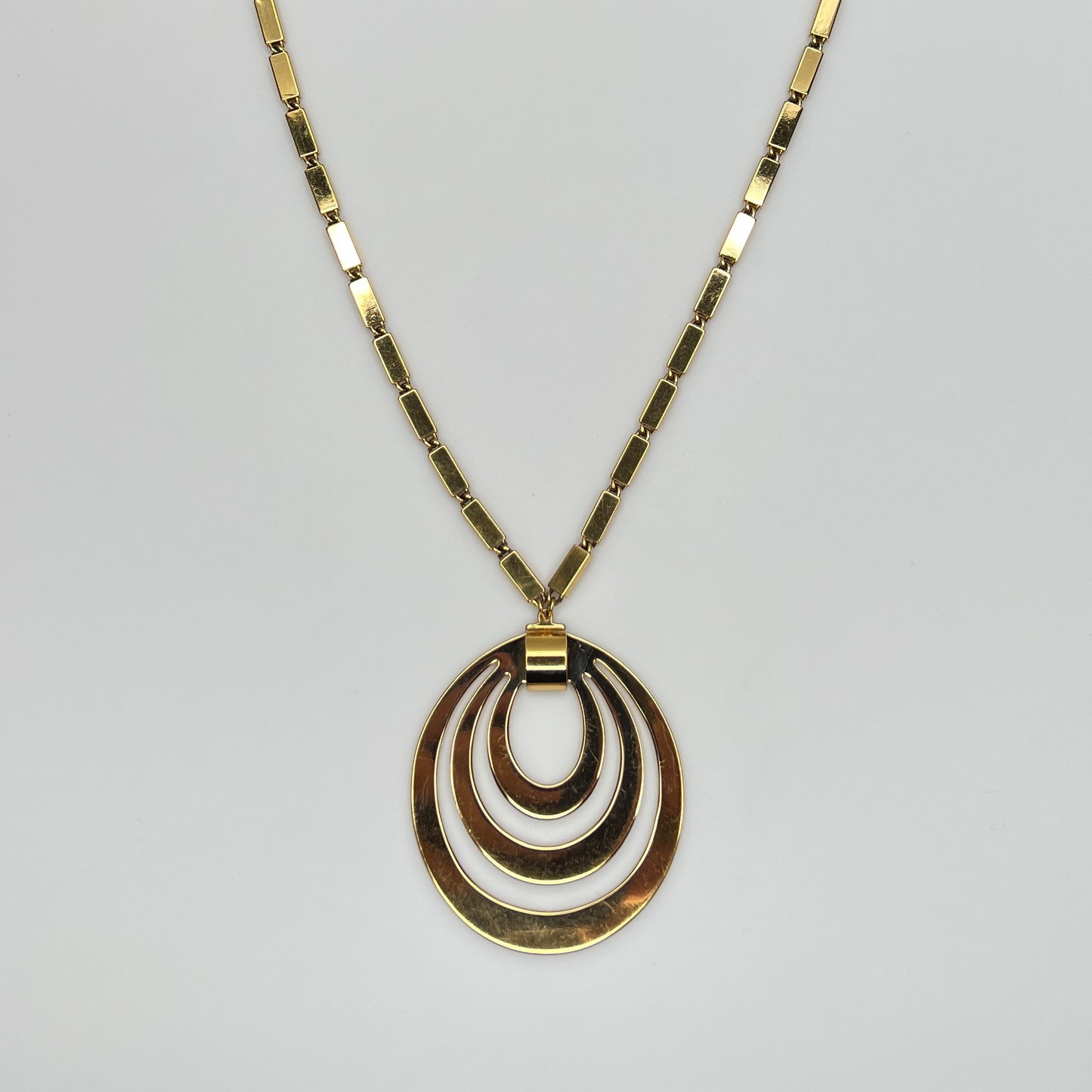 1980s Monet signed goldtone necklace with geometric pendant and rectangular chain